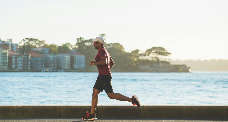 Man jogging outdoors to improve mental health and emotional balance through regular exercise.